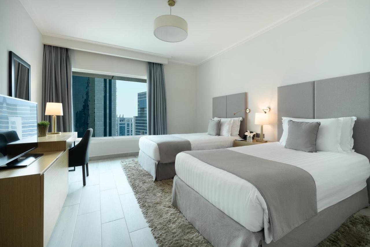 Centara West Bay Hotel & Residences Доха Экстерьер фото A guest room at the hotel