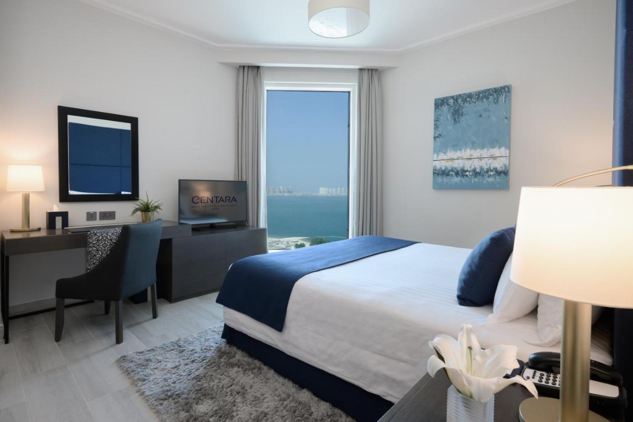 Centara West Bay Hotel & Residences Доха Экстерьер фото A bedroom at the Ritz-Carlton, Bahrain
